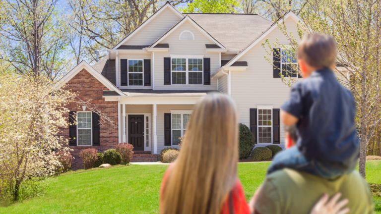 Family back facing looking at house