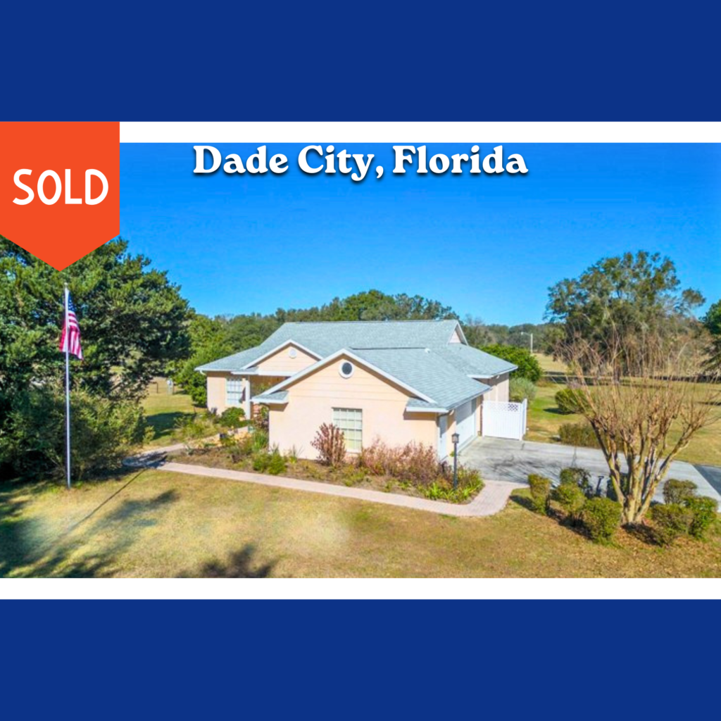 Sold photo in Dade City, FL - House trees driveway American Flag on flag pole