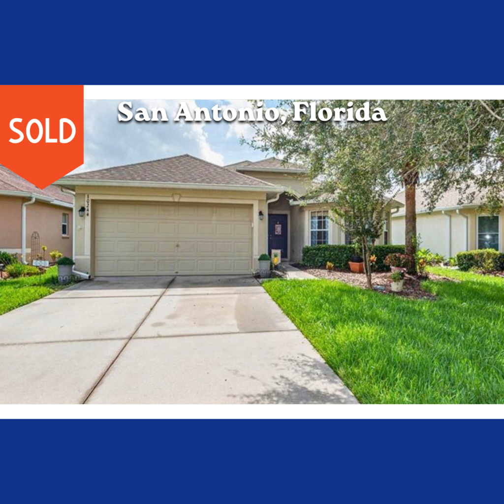 Sold photo in San Antonio, FL - House trees driveway